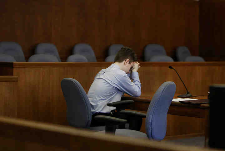 Donovan Nicholas  sits by himself during a recess in his sentencing at Champaign County Common Pleas Court in Urbana. Donovan was sentenced to life in prison with no chance of parole for 28 years for the murder of his step mom Heidi Fay Taylor.  (Eric Albrecht / The Columbus Dispatch)